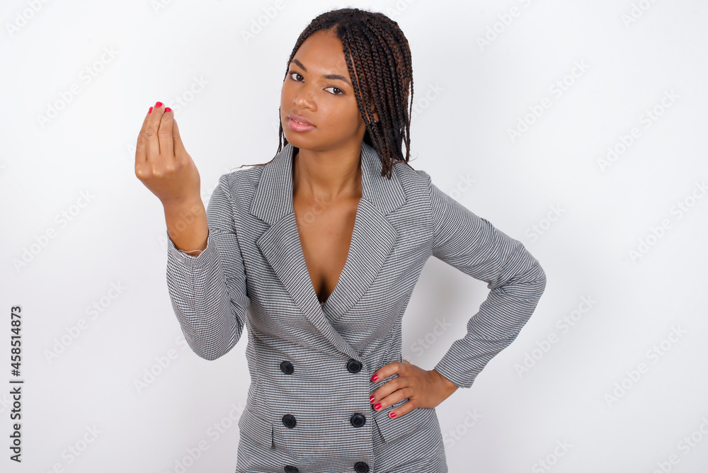 What the hell are you talking about. Shot of frustrated MODEL gesturing with raised hand doing Italian gesture, frowning, being displeased and confused with dumb question. What the hell are you talking about. Shot of frustrated MODEL gesturing with raised hand doing Italian gesture, frowning, being displeased and confused with dumb question.