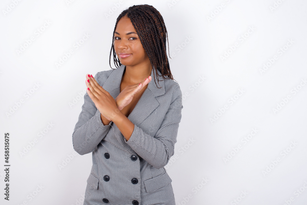 MODEL Has rejection angry expression on face and crossing hands doing refusal negative sign. MODEL Has rejection angry expression on face and crossing hands doing refusal negative sign.