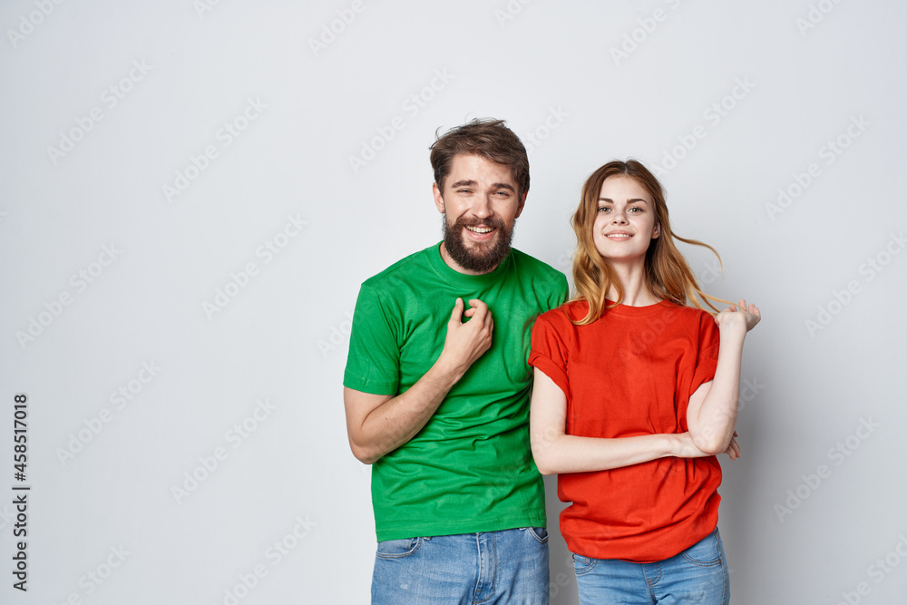 man and woman hug friendship colorful t-shirts family isolated background man and woman hug friendship colorful t-shirts family isolated background