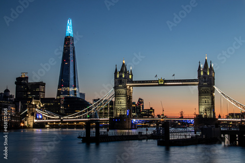 London  United Kindom - 31 May 2020 Long exposure of London skyline at sunset with The Shard with blue light in honor of the NHS and Tower Bridge.
