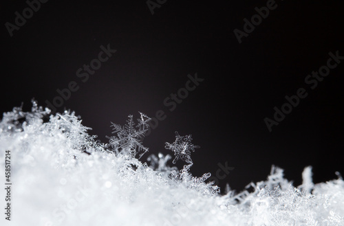 Snowflake on snow. Winter holidays and Christmas background 