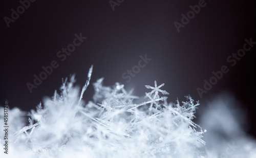 Snowflake on snow. Winter holidays and Christmas background 
