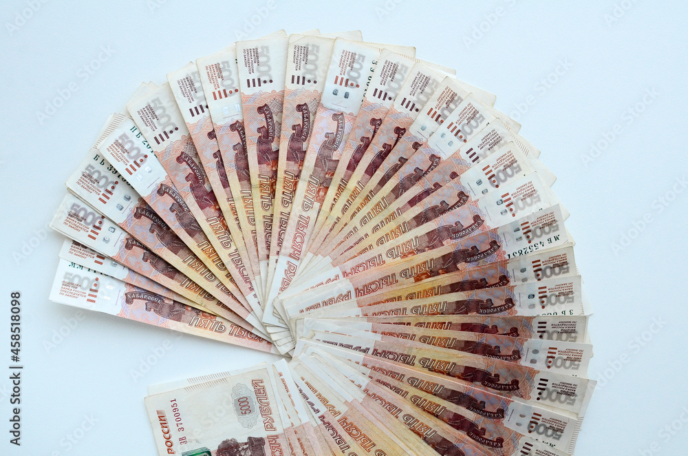 Background of bills is five thousand russian rubles. Bills are spread out like a fan. Concept of finance, business, income, wealth, success. Flat lay of banknotes, top view, close up.