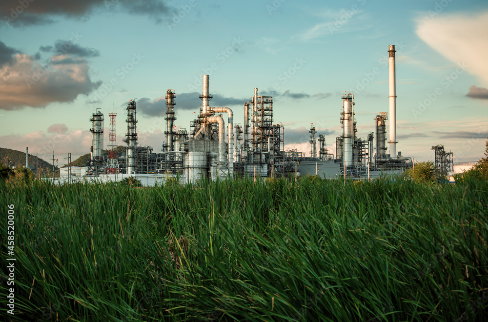 Obraz premium Scene evening of tank oil refinery plant tower and column tank oil of Petrochemistry industry