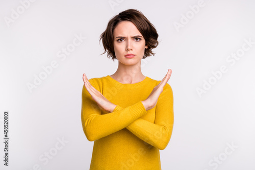 Obraz na plátně Photo of young woman crossed hands show no stop ban block reject sign isolated o