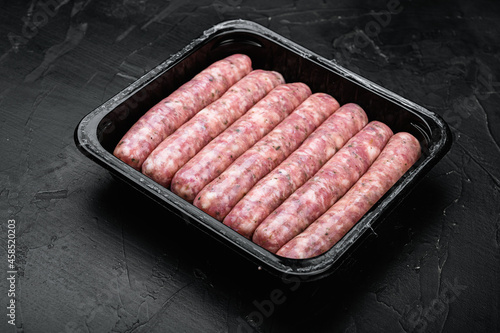 Sausage pack, on black dark stone table background