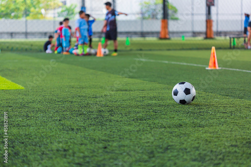 Fototapeta Naklejka Na Ścianę i Meble -  Soccer ball tactics cone on grass field with for training background