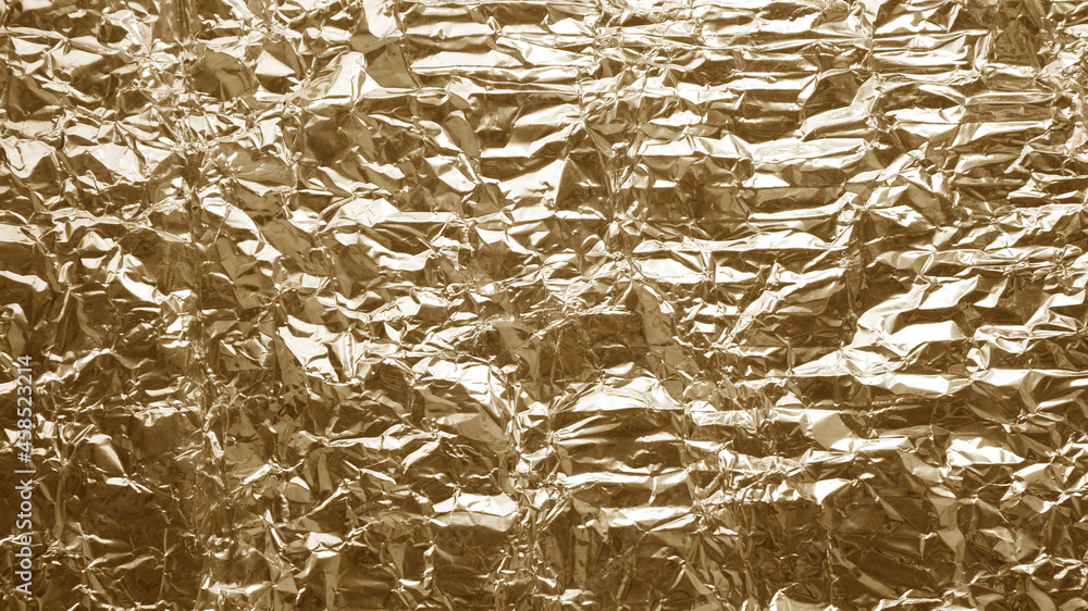 Shiny yellow gold foil abstract texture background Shiny yellow gold foil abstract texture background