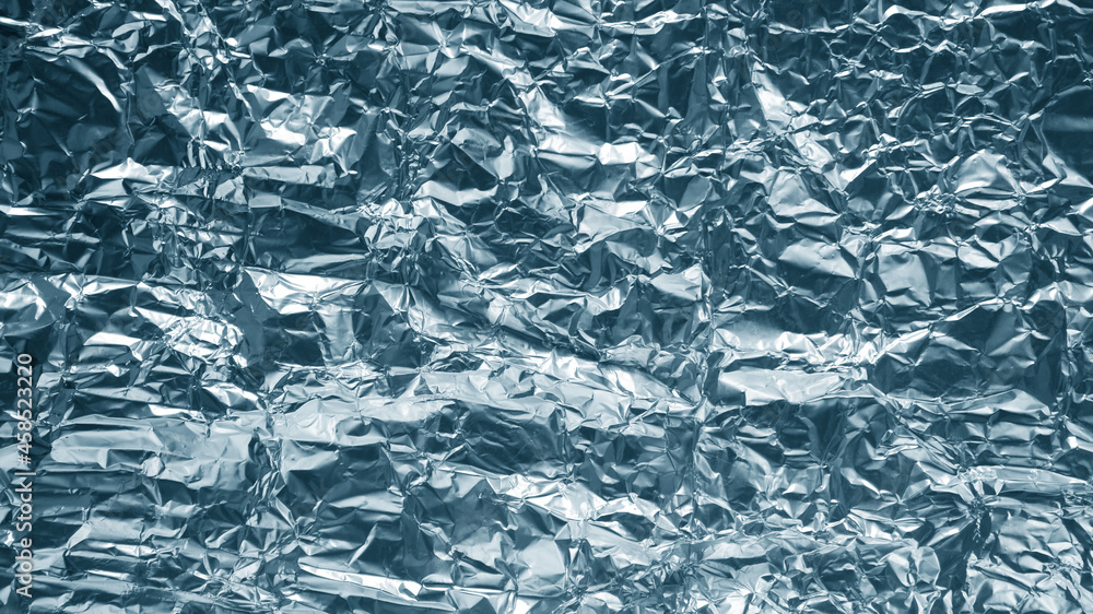 Silver crumpled foil shiny metal texture background wrapping paper for wallpaper decoration element. Silver crumpled foil shiny metal texture background wrapping paper for wallpaper decoration element.