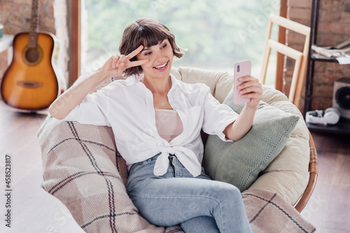 Photo of cute brunette hairdo millennial lady do selfie wear white shirt jeans alone at home
