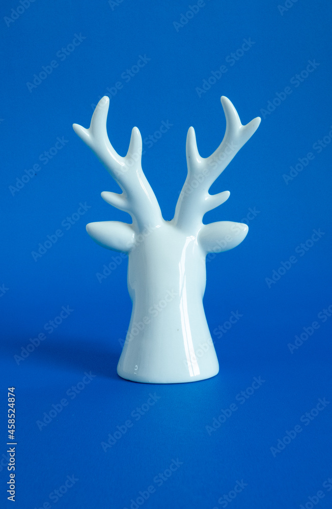 reindeer head on white and blue background reindeer head on white and blue background
