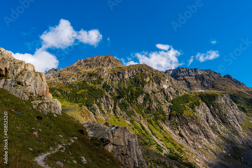 Grand scenic mountain vistas in the Swiss Alps. Summer, clouds, blue sky, no people.