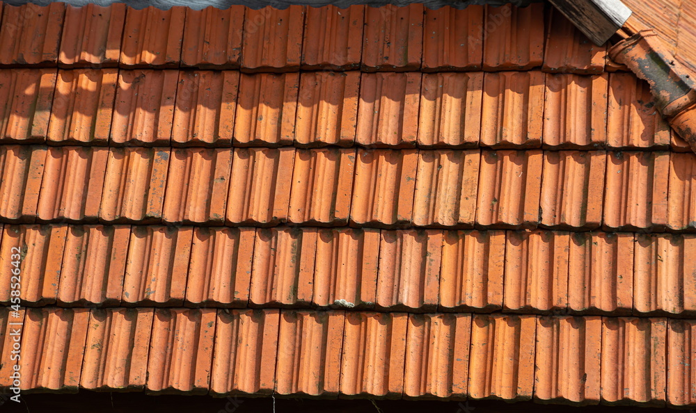 roof tile. tile roof of a old house. tile roofs used in old and modern style construction for safety and also it keeps house cool inside