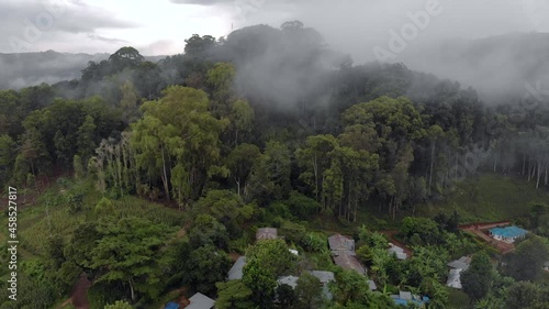  aerial drone shot flying by cloudy misty foggy lushoto village in usambara mountains remote place in tanga province tanzania africa photo