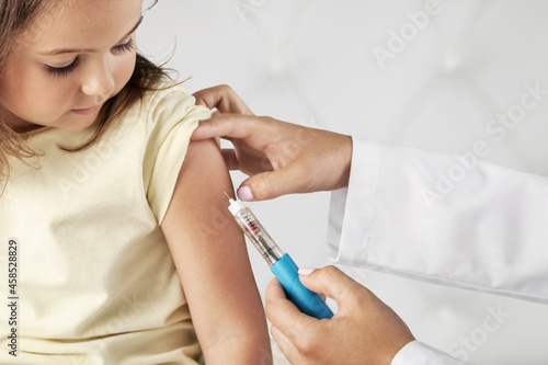 Young patient visits a skillful doctor at hospital for vaccination . Covid 19 and coronavirus vaccination