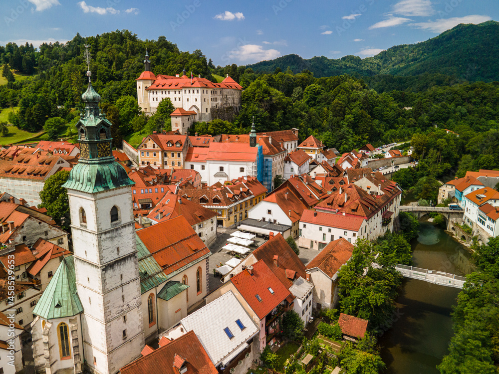 Skofja Loka in Slovenia. Medieval Old Town, Bell Tower and Castle. Drone View