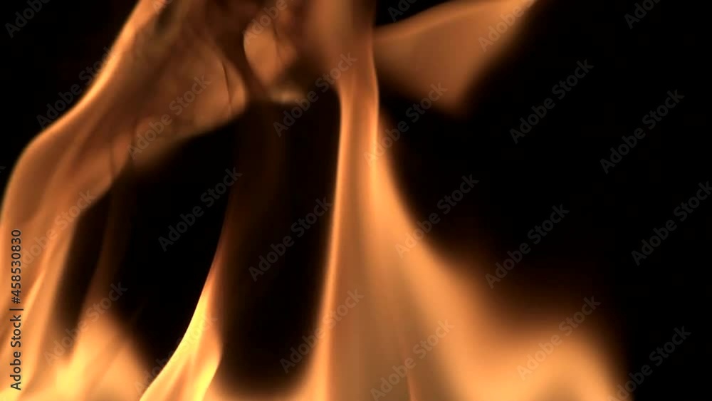 Natural red-orange flames on a black background. Natural red-orange flames on a black background.