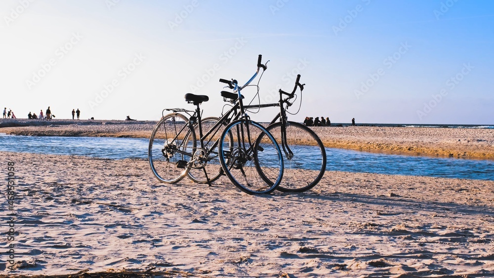 Fototapeta premium Two Bikes on Seashore Beach Sand