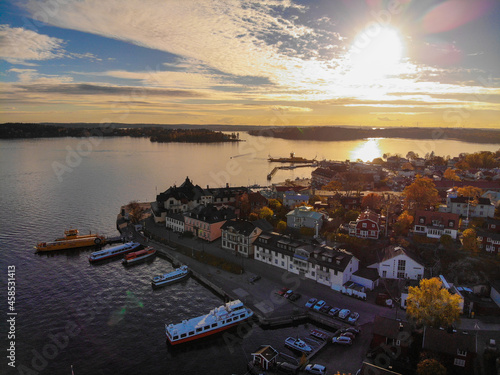 Sun sets over Vaxholm on the Swedish archipelago photo