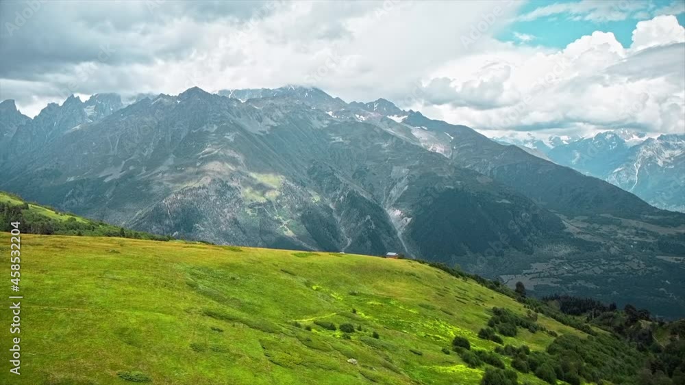 Aerial drone view of nature in Georgia. Caucasus Mountains, greenery, valleys, lush clouds Aerial drone view of nature in Georgia. Caucasus Mountains, greenery, valleys, lush clouds