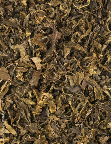 used or brewed dried green tea leaves, to be used as natural organic fertilizer, increase nutrient levels and improve soil quality, closeup view