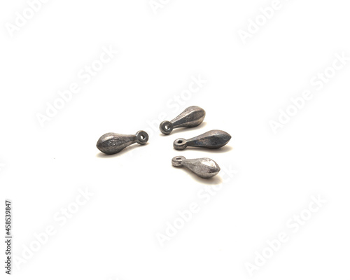 Four silver bank sinkers fishing terminal tackle isolated on white photo