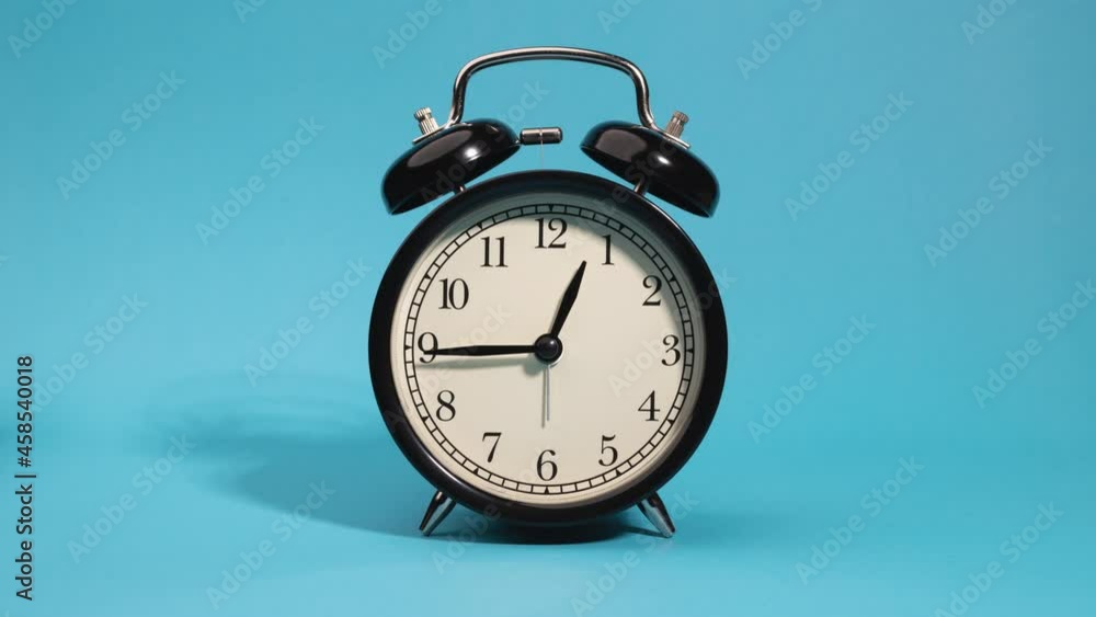 stop-motion alarm clock on blue