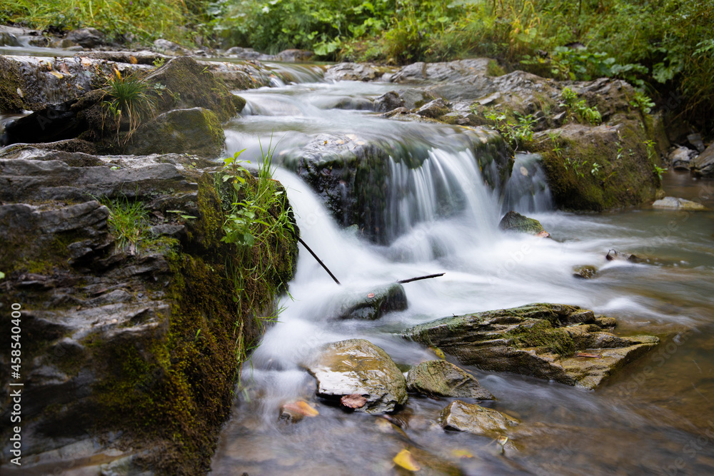 Small waterfall in forest (moody and relaxing)