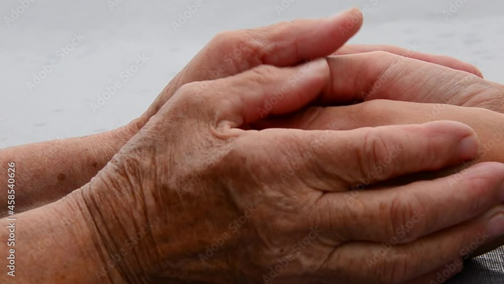 Old and young hands together. Comfort. Support. Caring and guardianship. Seniors concept. Grandmother's hands in young hands. Old and young hands close up. Touching old hands. Respect for parents