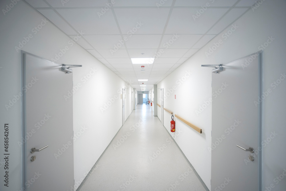 empty clean and white corridor in modern medical interior empty clean and white corridor in modern medical interior