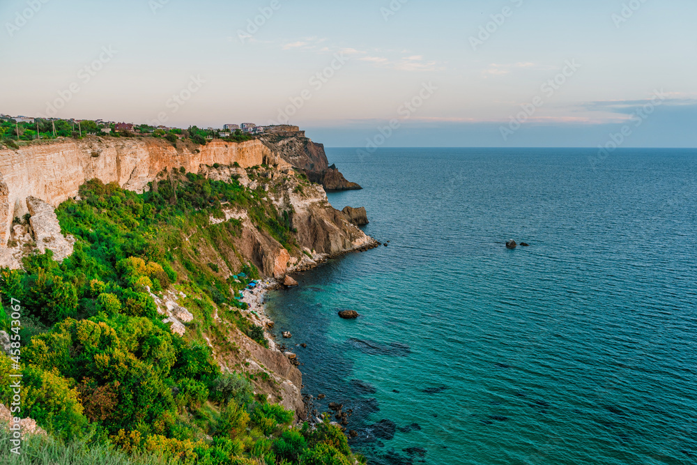 Fototapeta premium Amazing landscape at sunset, rocks and the sea on Cape Fiolent in Crimea.