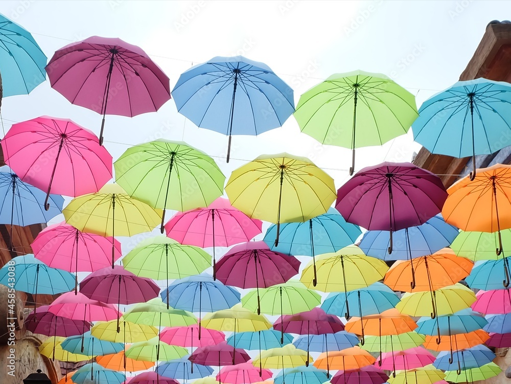 colorful umbrellas on sky background