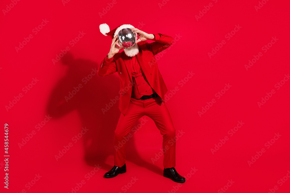 Obraz premium Photo of funky funny age gentleman wear new year costume headwear dancing disco ball close face isolated red color background