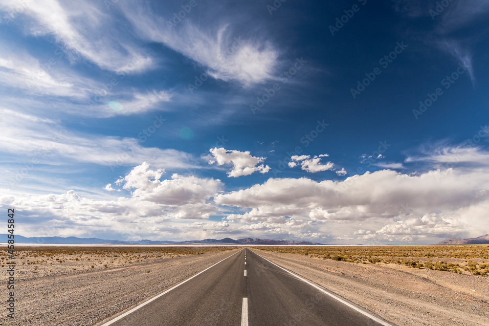 Centered road middle POV in a salt field. Salinas Grandes, Jujuy,  Northern Argentina. Symmetrical landscape photography.