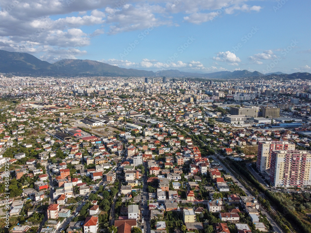 Aerial drone view Tirana, Albania. Buildings, streets and residential houses. A view from above on the roof of the houses in city of Tirana.