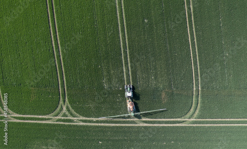 Tractor Spraying Controversial Glyphosate on Farmland photo