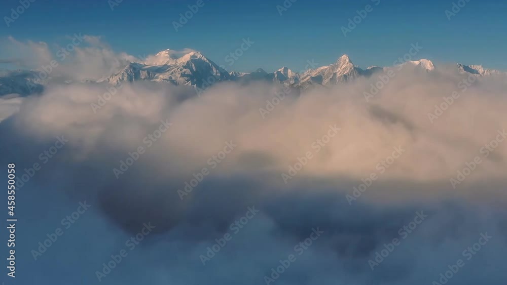 Huanglong, Sichuan, China. Aerial view of a beautiful alpine landscape with a sea of clouds. Mountain range of western Sichuan, mountains and Chuangsinan highlands. (drone time-lapse) Huanglong, Sichuan, China. Aerial view of a beautiful alpine landscape with a sea of clouds. Mountain range of western Sichuan, mountains and Chuangsinan highlands. (drone time-lapse)