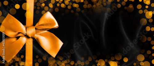 golden bow on black background