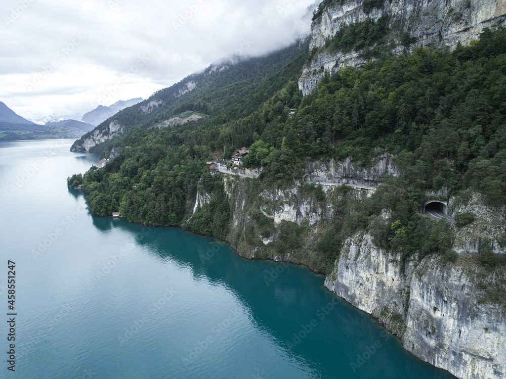 Winding Road and Tunnels Around a Swiss Lake