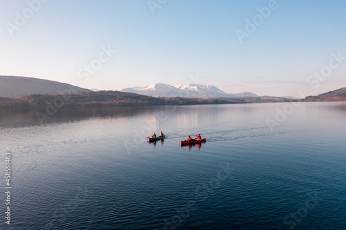 Canoeists on a Lake with Mountains in the Distance