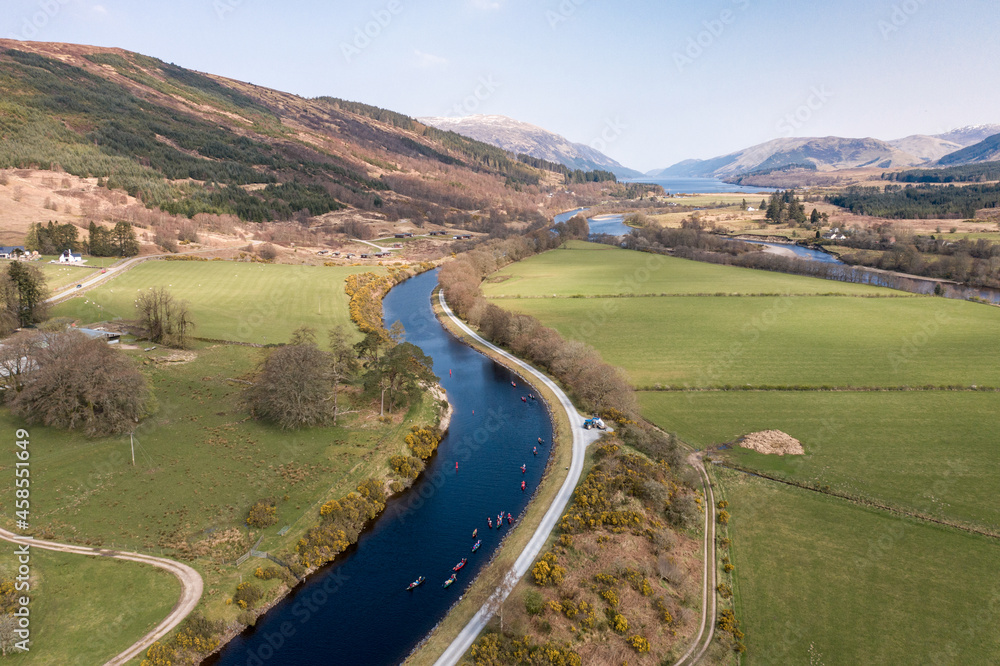 Canoeists on a River Surrounded by Beautiful Landscape