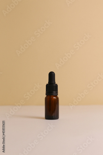 Beauty natural skincare products development concept. Dermatologist cosmetic skincare bottle with pump dispenser and organic ingredient on neutral background.