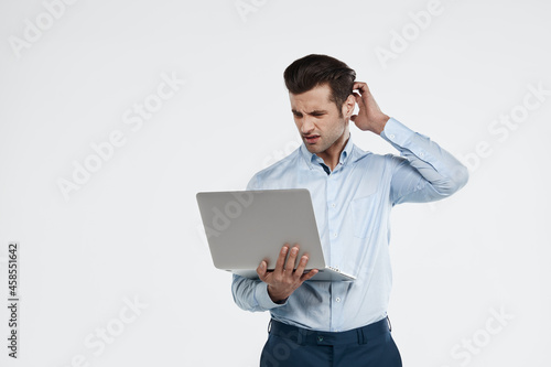 European business man watching something on laptop