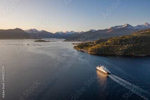 Passenger Shuttle Ferry Crosses a Fjord Arriving into Port