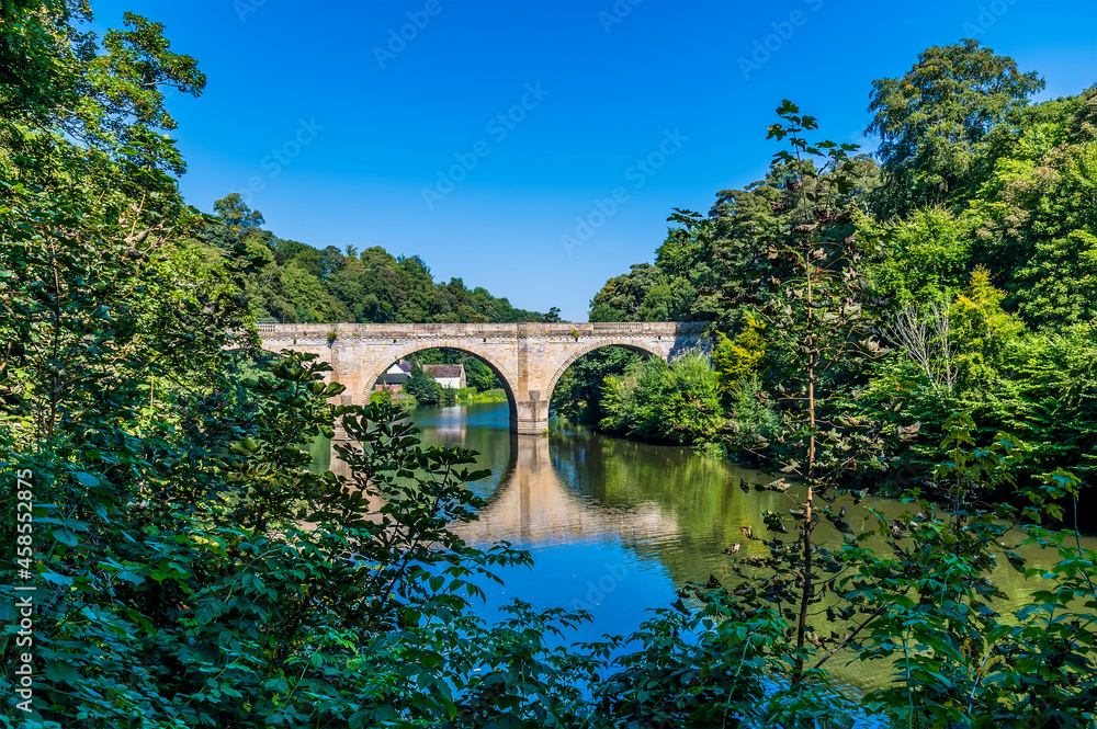 A view down the River Wear towards the Prebends Bridge in Durham, UK in summertime