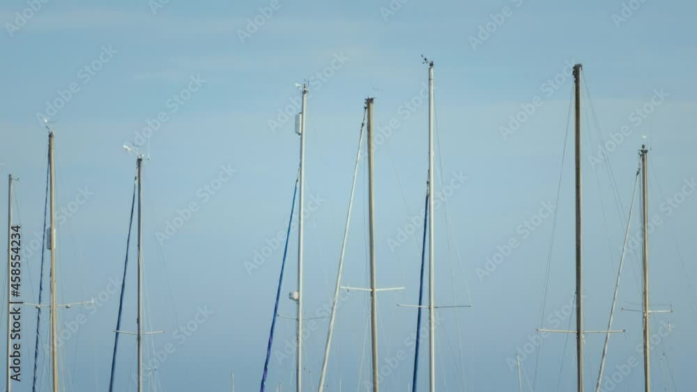 Swinging yacht masts against clear blue sky. Scotland Swinging yacht masts against clear blue sky. Scotland