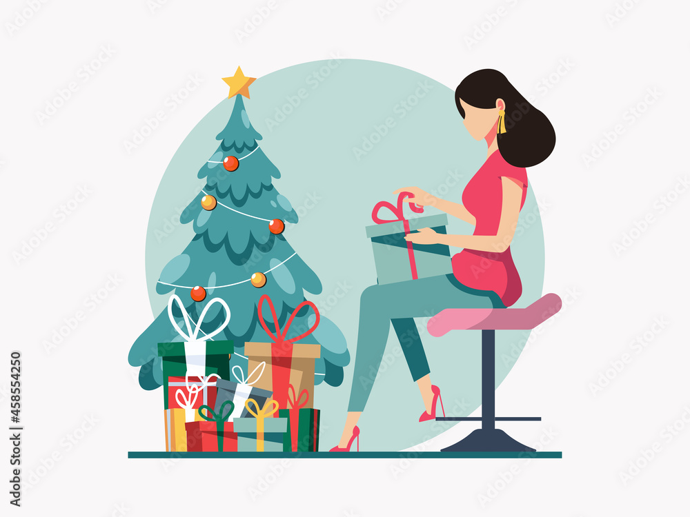 Women opening a present box beside a Christmas tree.