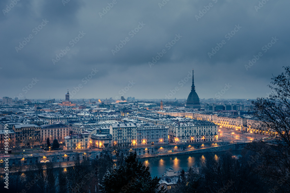 Turin cityscape at night in winter with snow