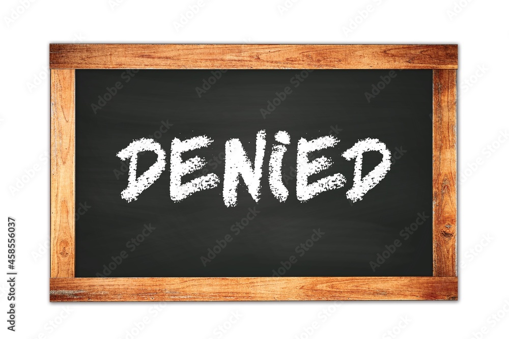 DENIED text written on wooden frame school blackboard. DENIED text written on wooden frame school blackboard.