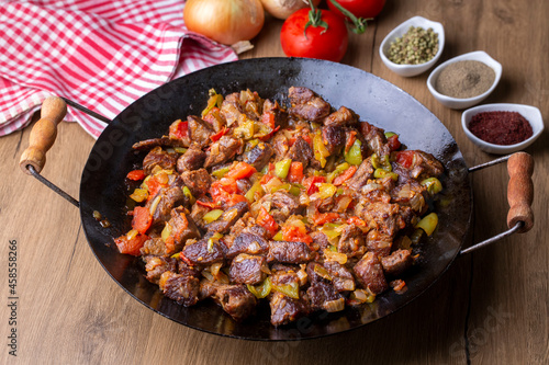 Meat saute in traditional pan - Sac kavurma, Turkish Food photo